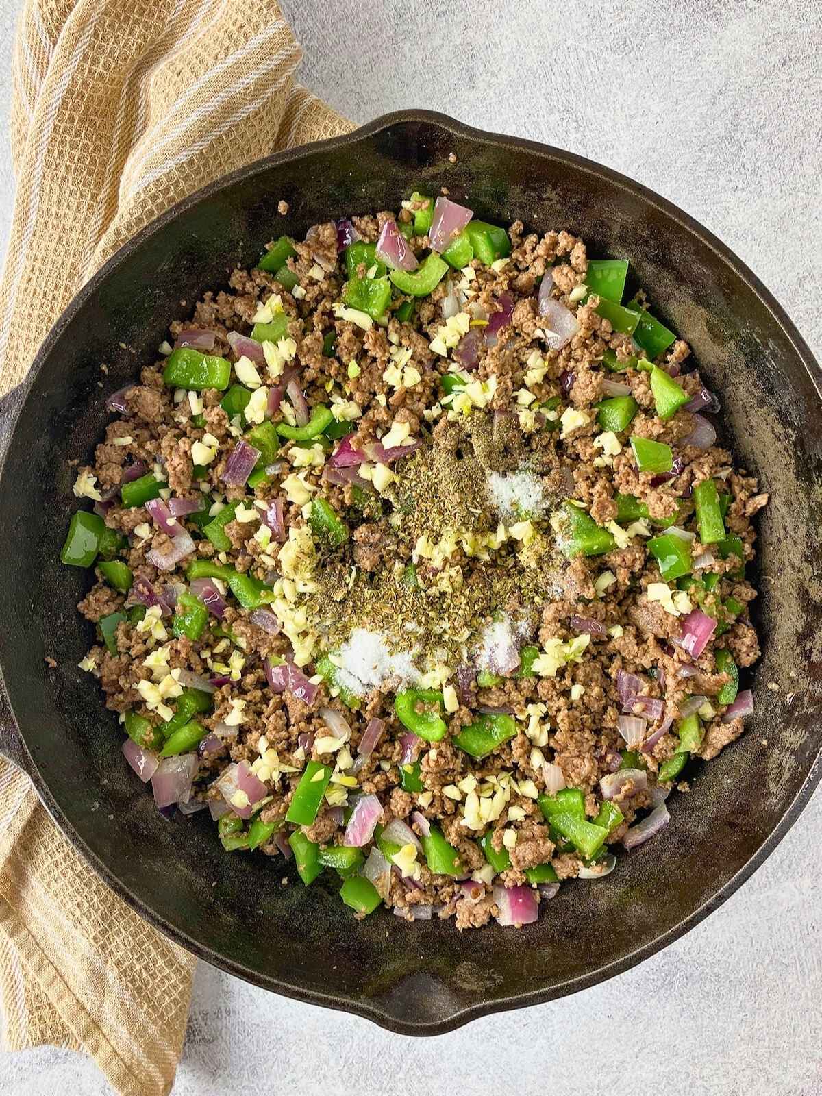 Chopped garlic and seasonings were added to the ground beef mixture.