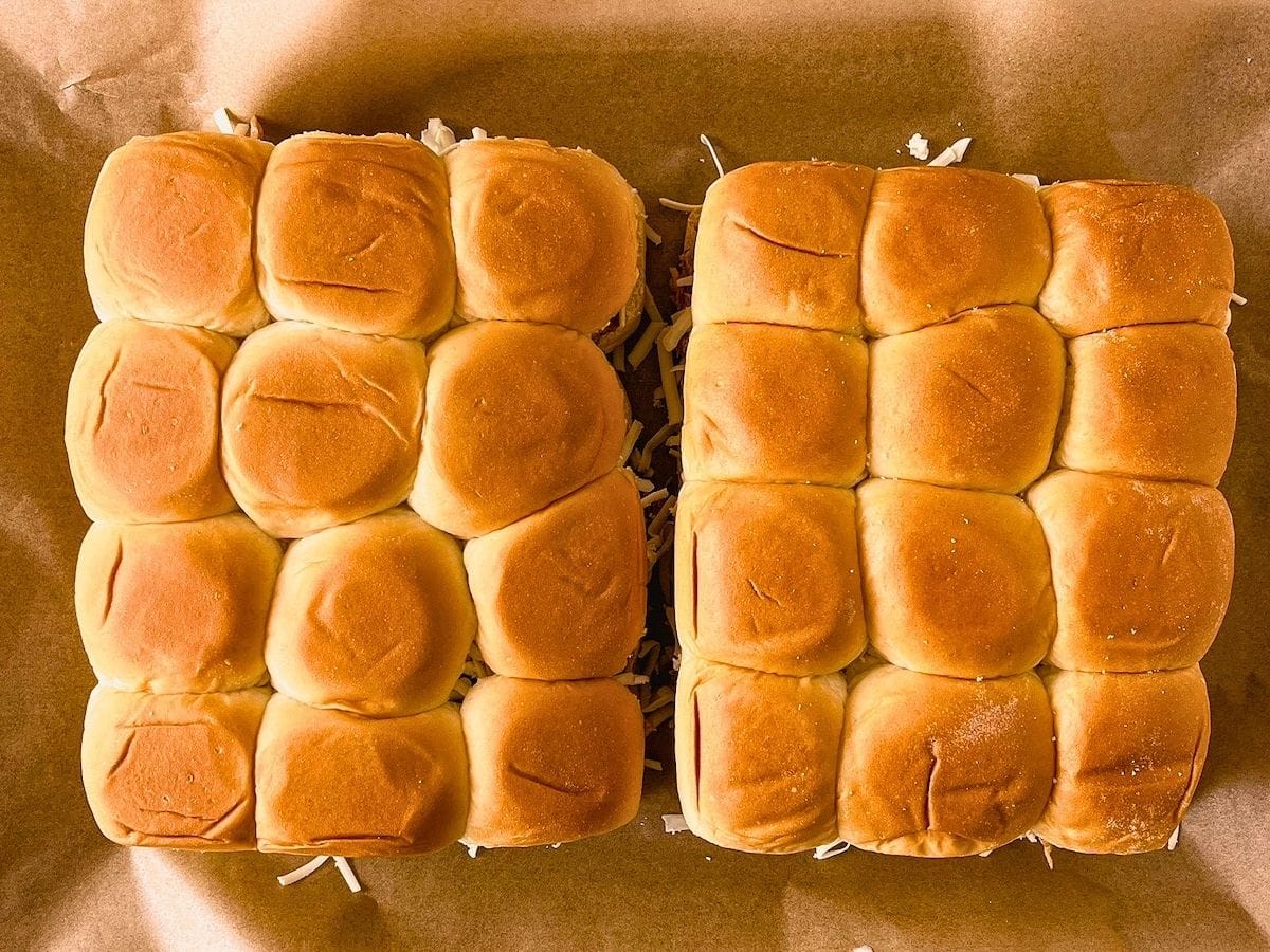 The top layer of buns was added on top of the cheese.