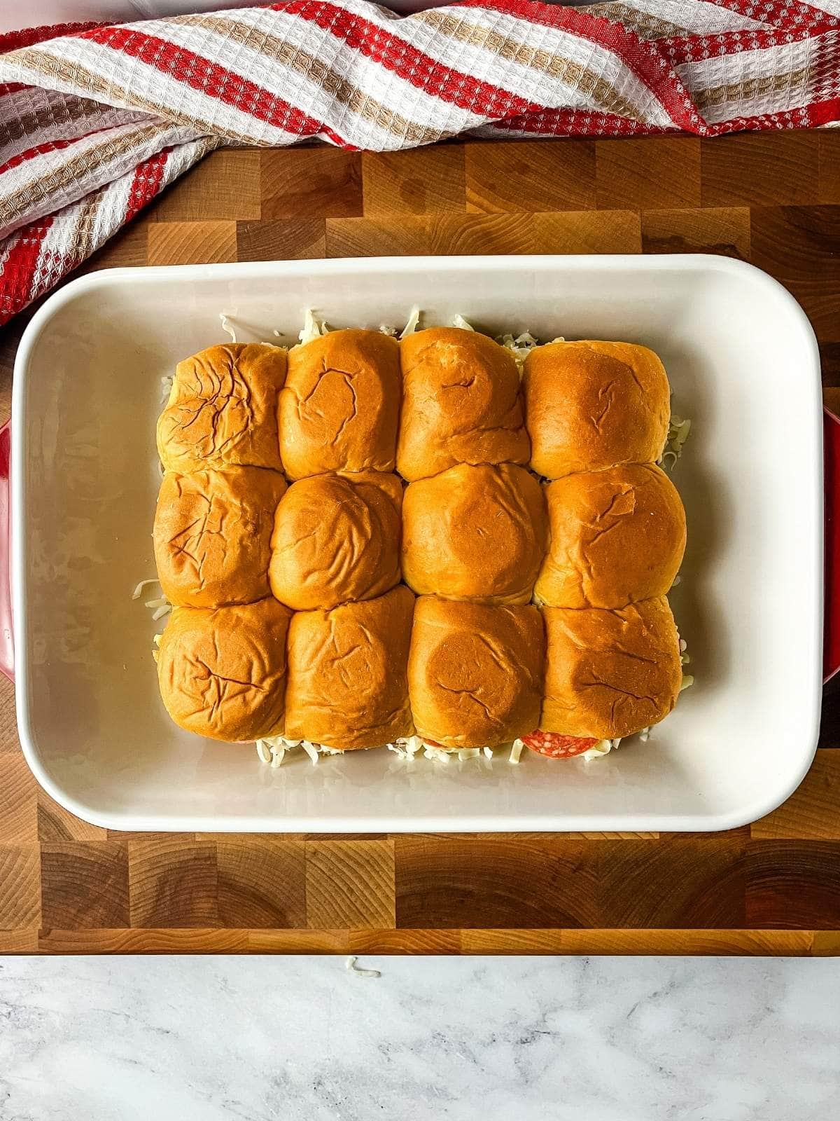 The tops of the rolls were placed on the sliders.