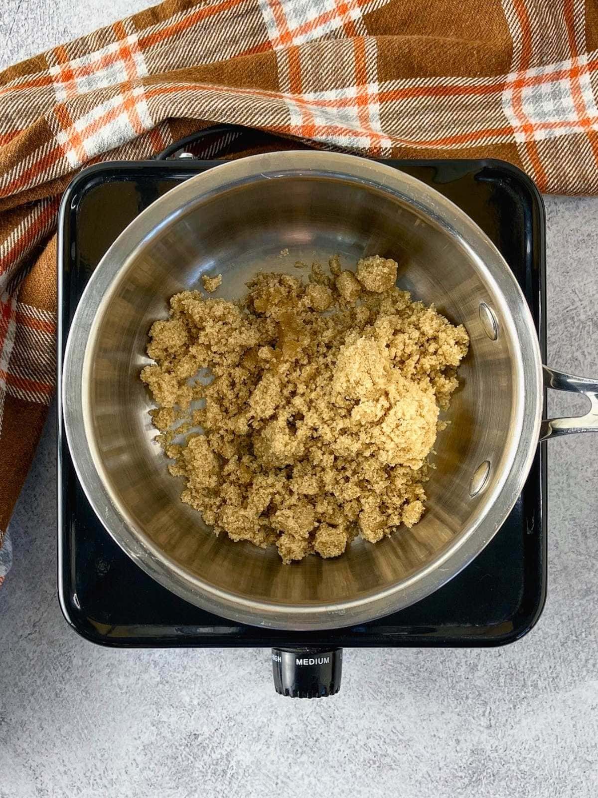 The brown sugar was added to a small saucepan.