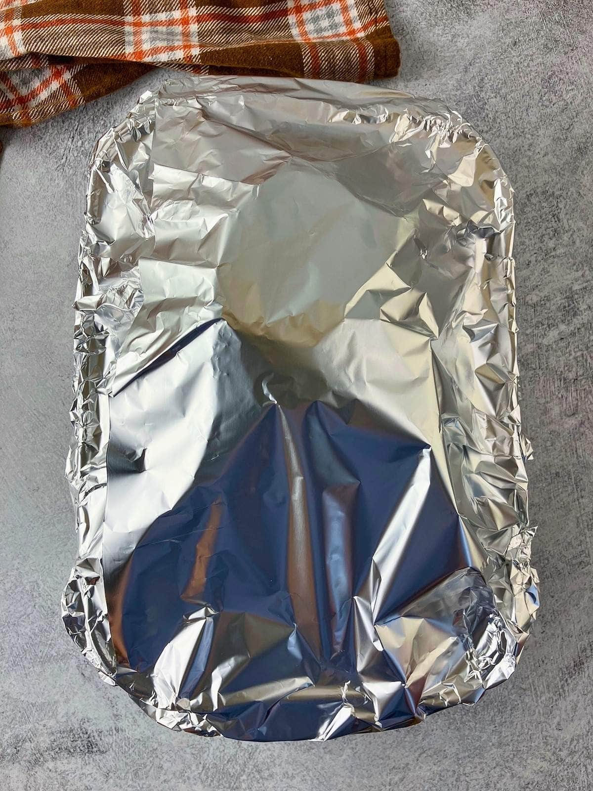 The ham was covered with foil.