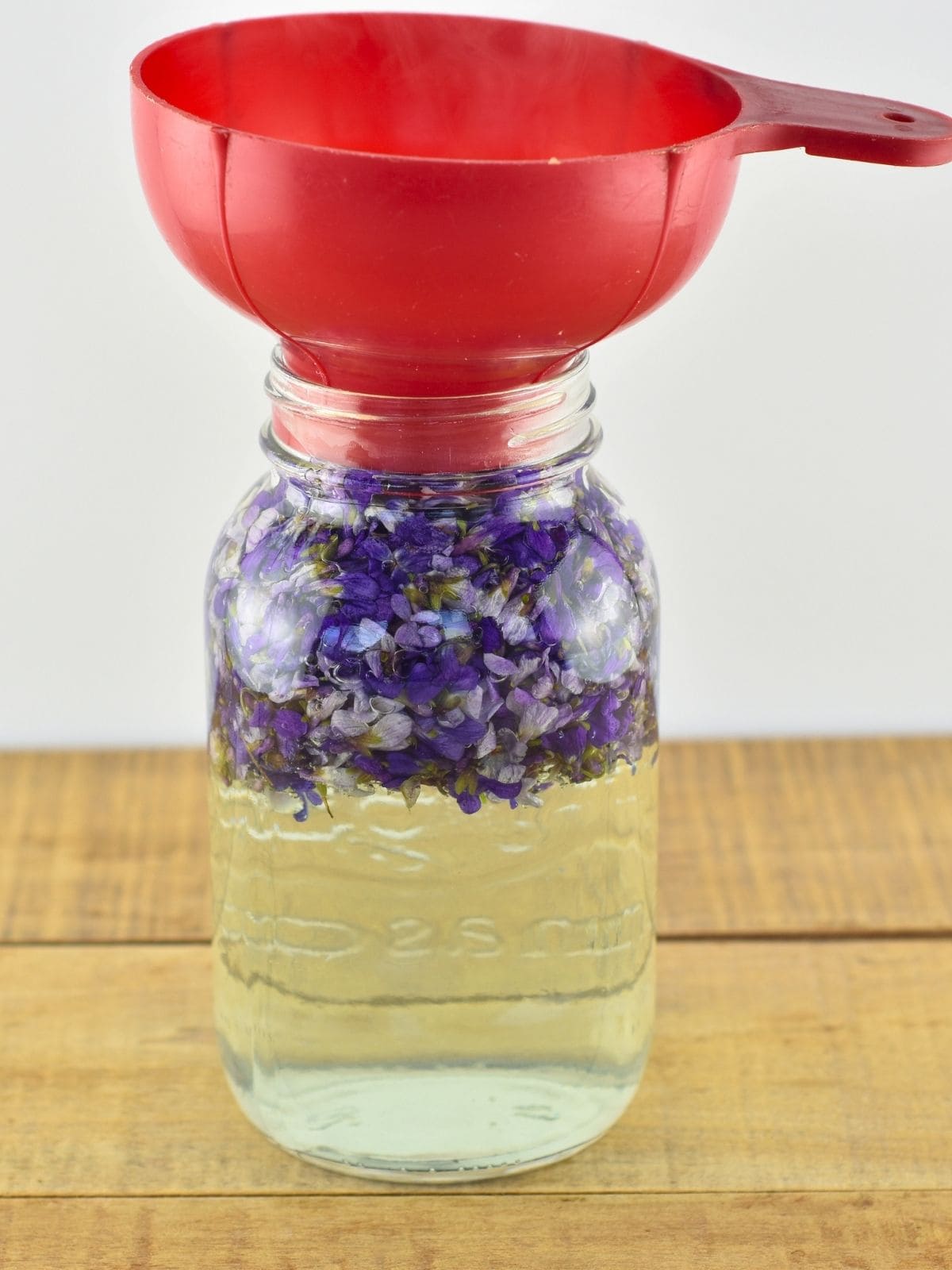 Hot water poured over the wild violet flowers.
