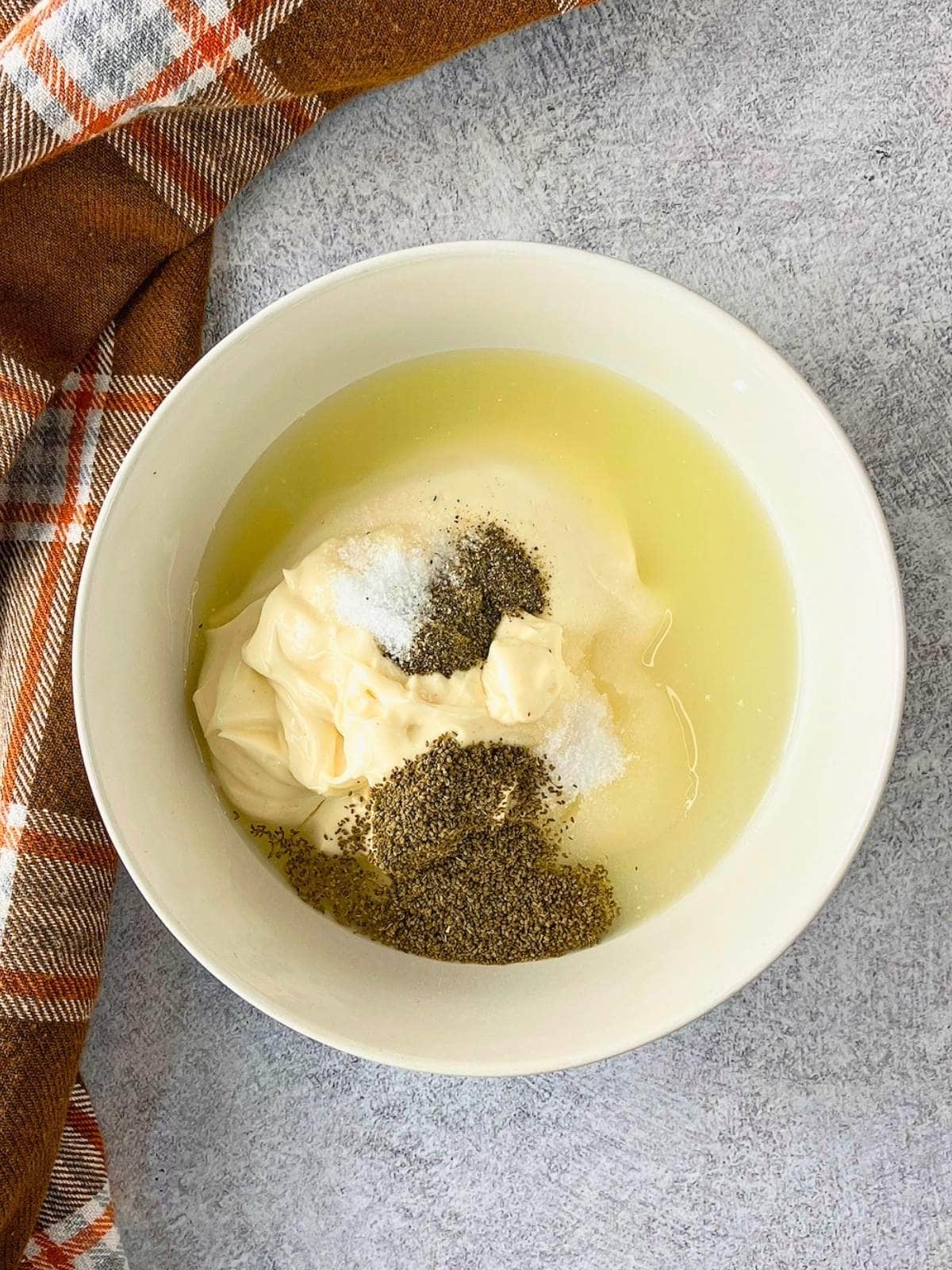The lemon juice, sugar, and other seasonings were added to the bowl.