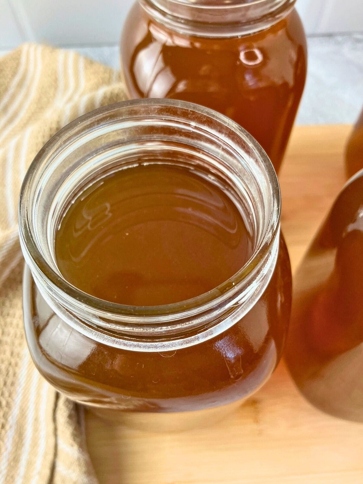 Mason jars filled with homemade vegetable broth.