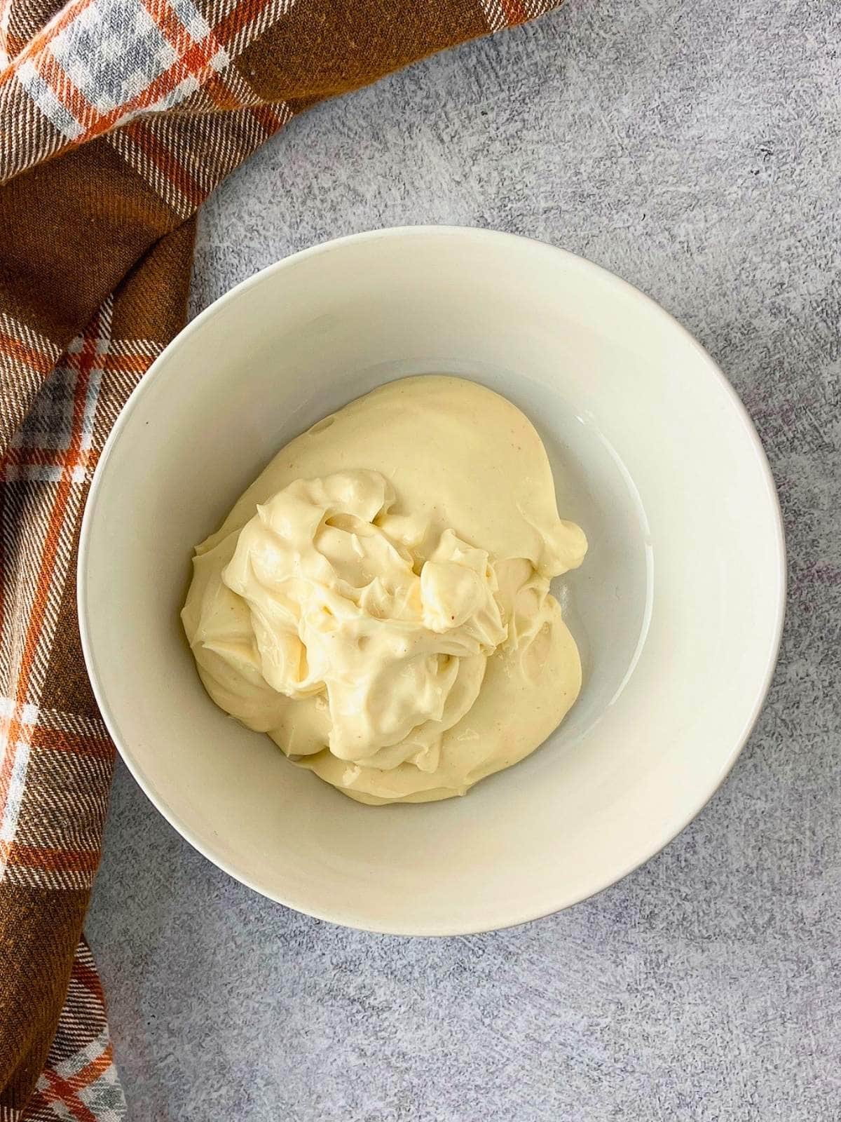 The Miracle Whip was added to a small mixing bowl.