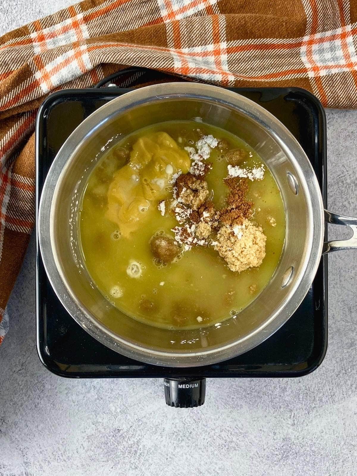 The orange juice was added to the pot.