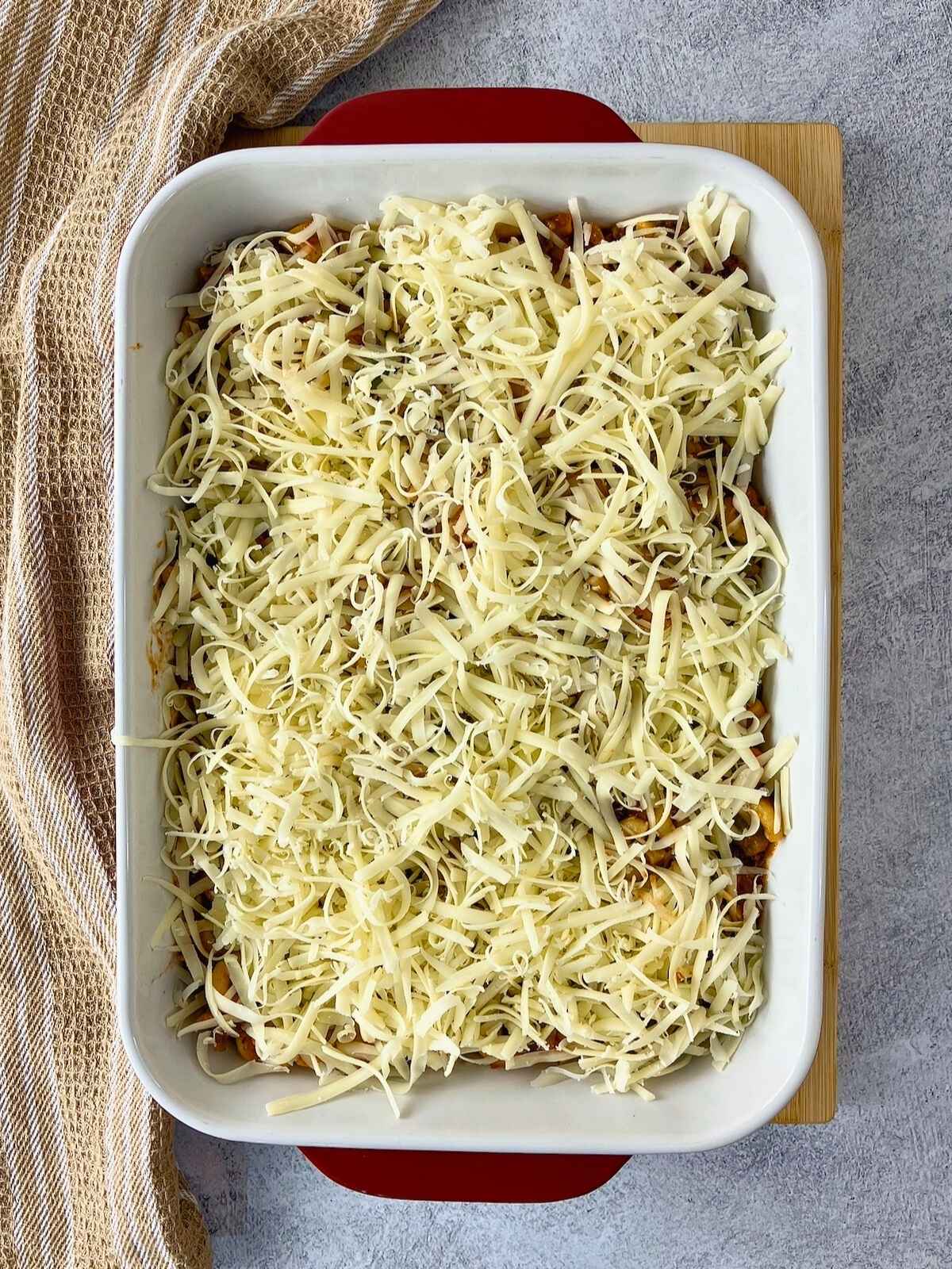 The mozzarella cheese was sprinkled over the pasta.
