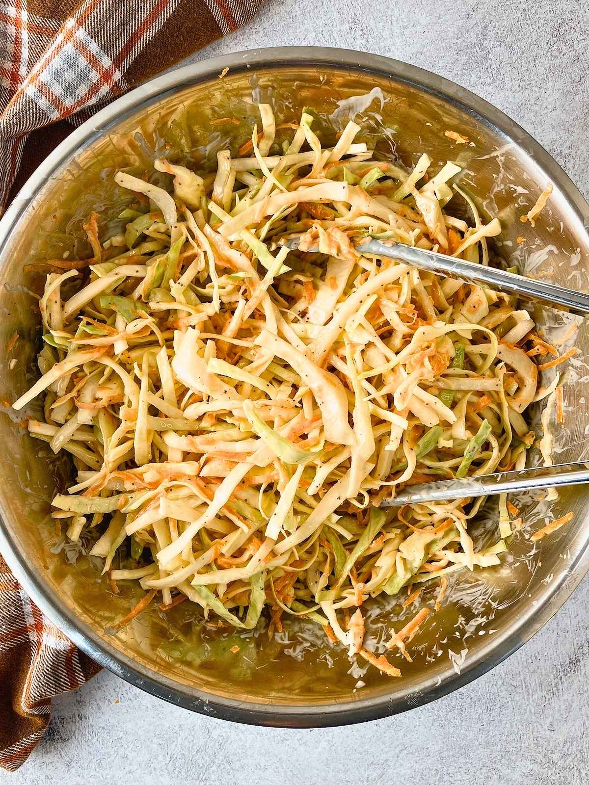 The coleslaw and dressing have been tossed together.
