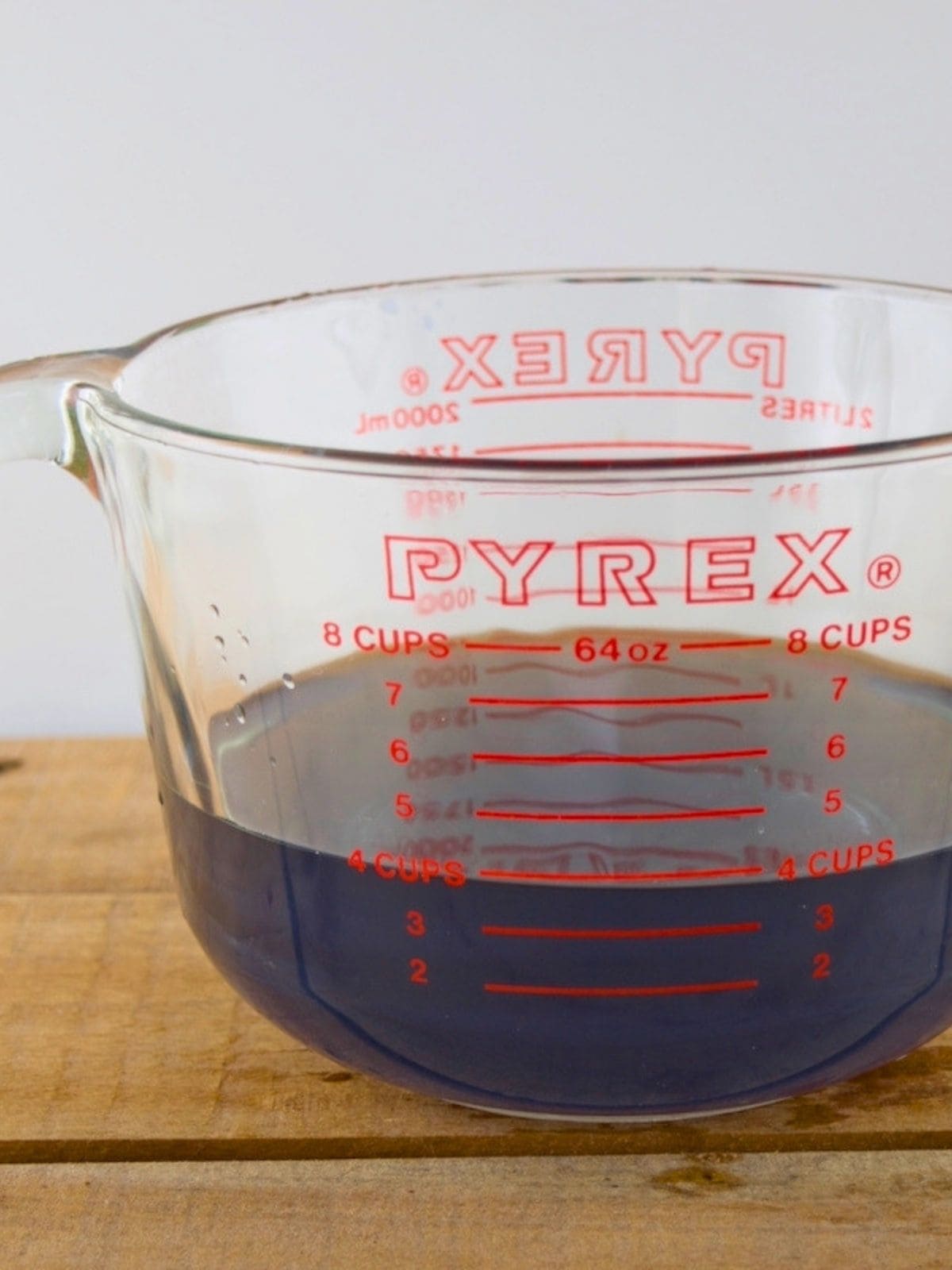 A dark blue wild violet tea after straining.