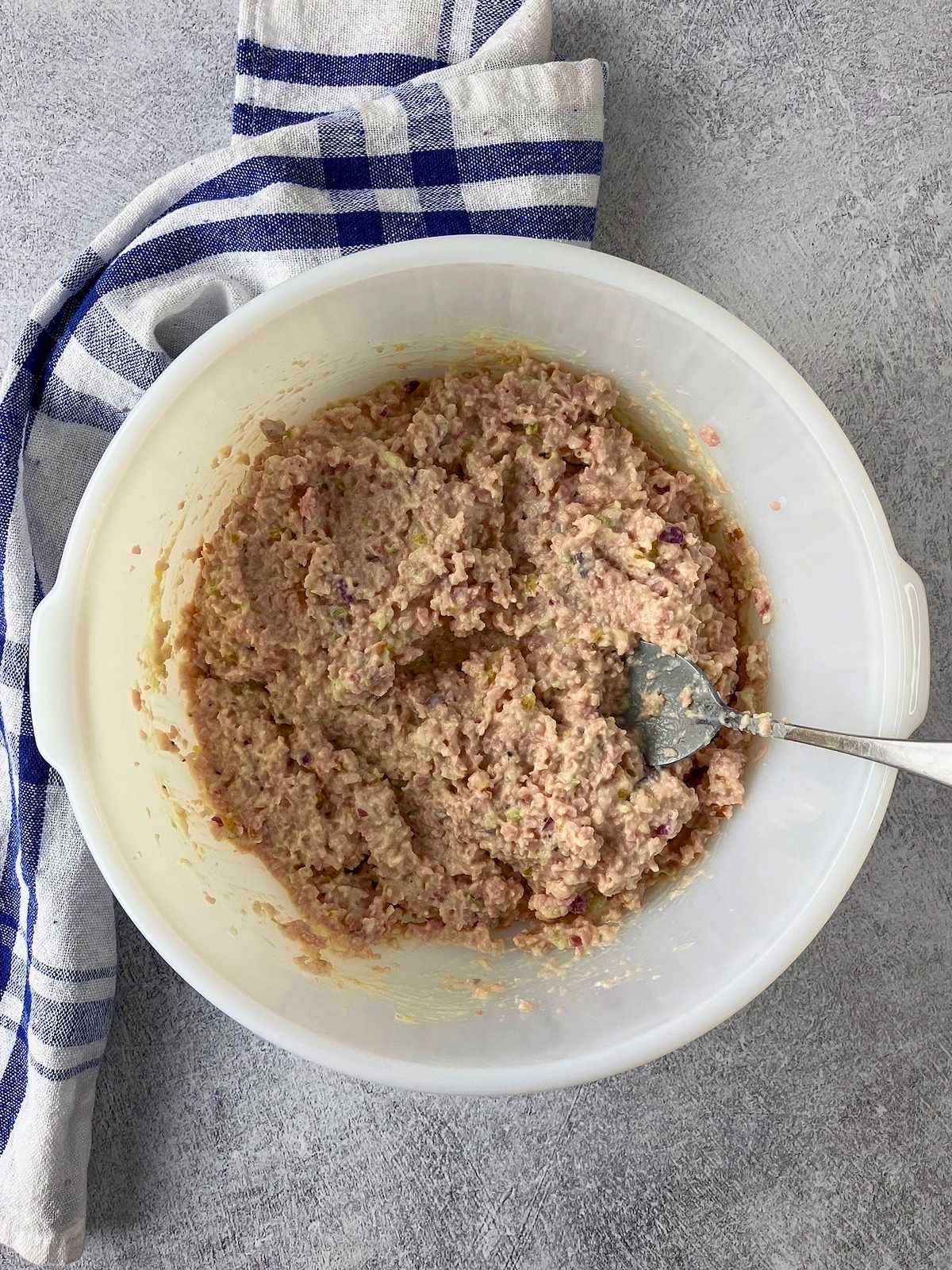 The ham and dressing were mixed together.