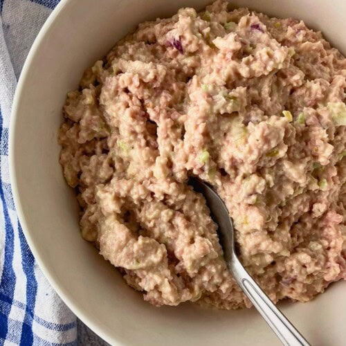 Ham salad in a serving bowl with a spoon.