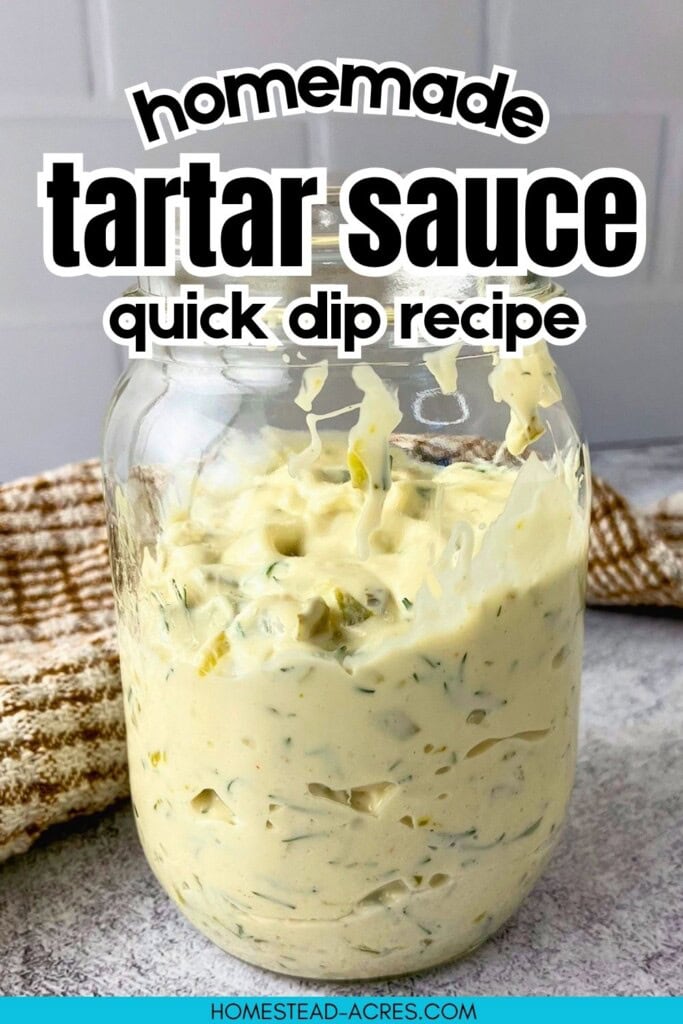 Glass jar filled with creamy homemade tartar sauce with dill and pickle pieces on a gray counter. Text reads "homemade tartar sauce quick dip recipe".