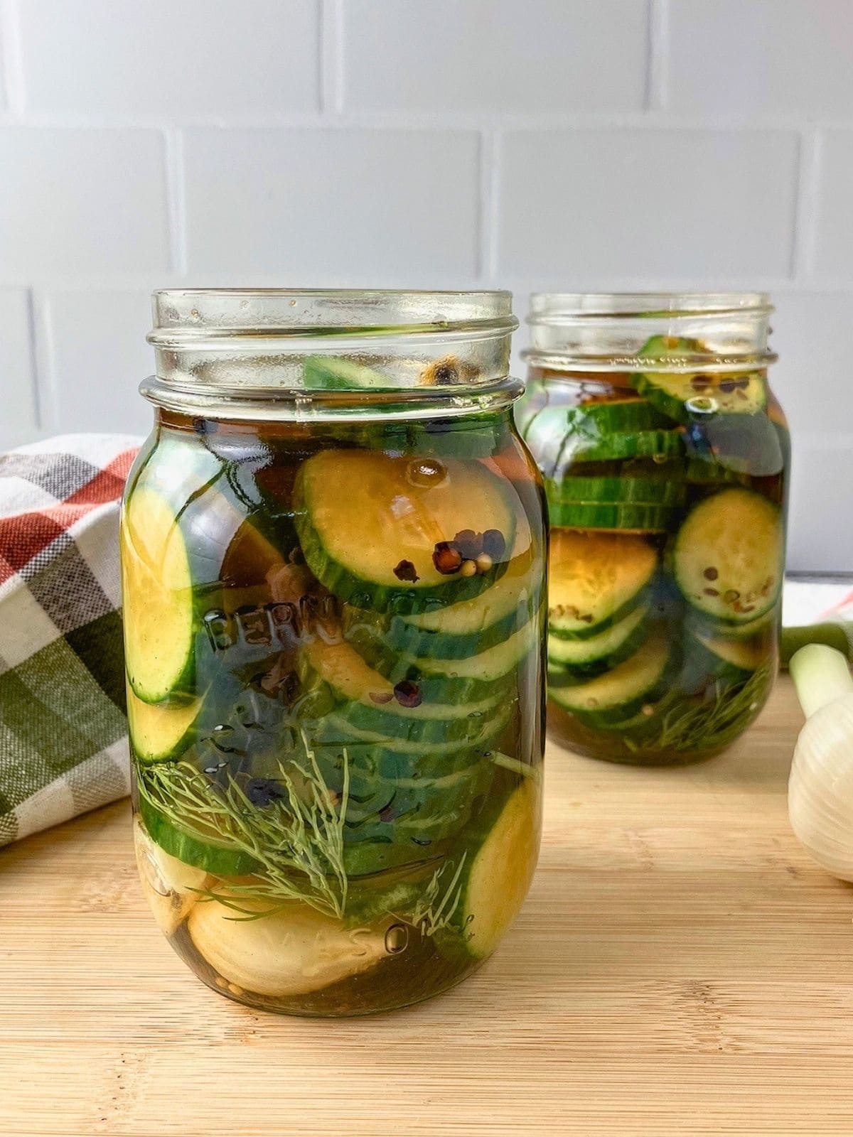 The homemade pickle brine was poured over the cucumber slices.
