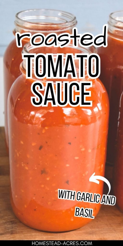 Mason jars filled with roasted tomato sauce on a wooden surface, with garlic and basil mixed into the sauce.